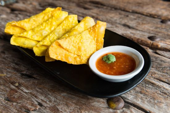 Deep Fried Wonton on plate wooden background